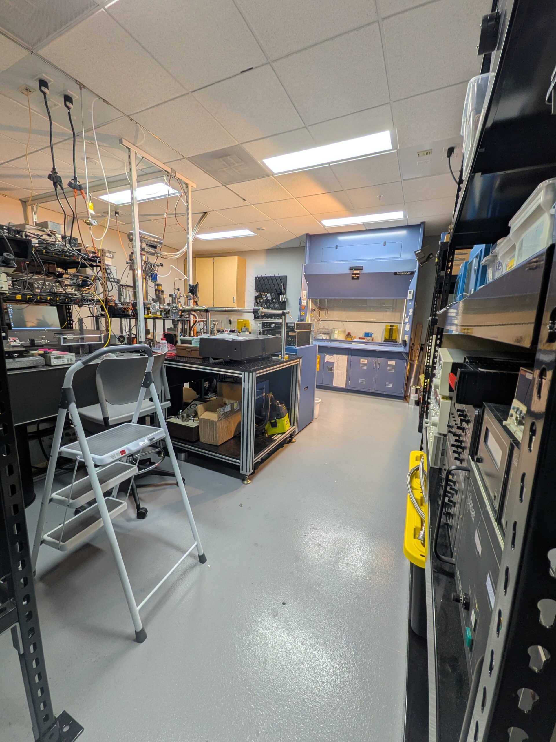 Research laboratory with fume hood, optical table, and electronics benches