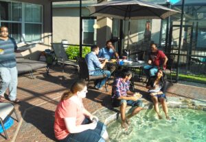 Students outside by the pool