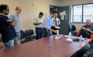 Research group having cake
