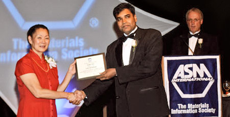 Dr. Seal at ASM International receiving an award