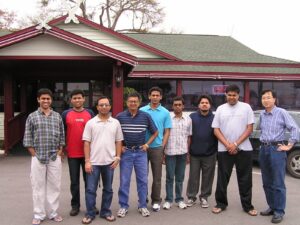 Group photo of students in front of restaurant