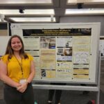 Student with research poster